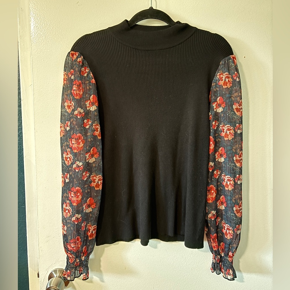A Love Story- Chic Black Blouse with Floral Sleeves